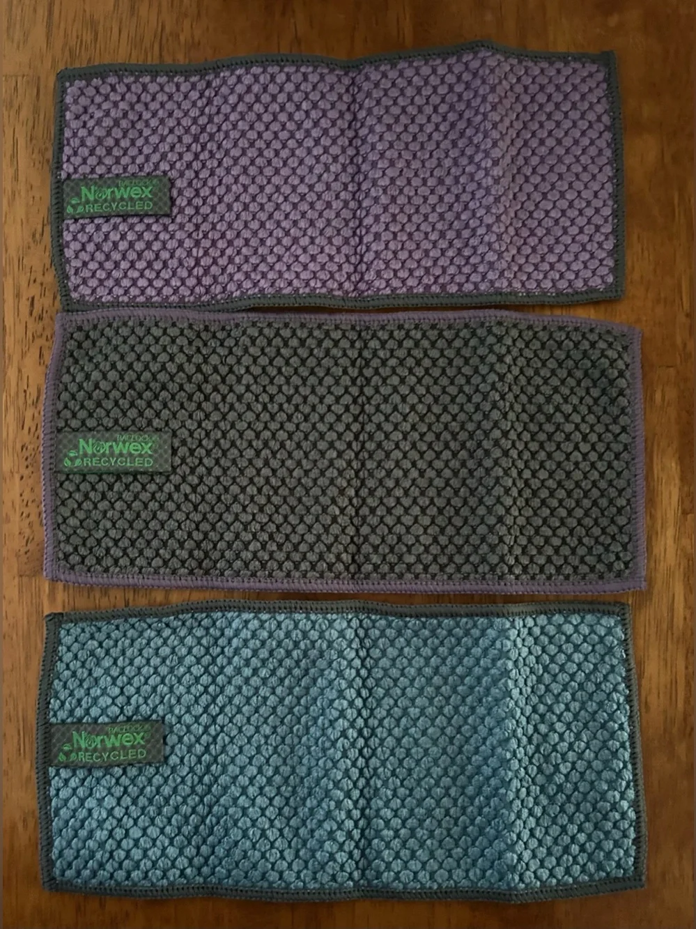 New-Norwex counter cloth 3 pack in eggplant, slate and teal.